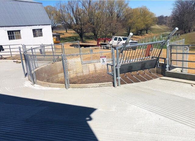 A large concrete container used for manure storage