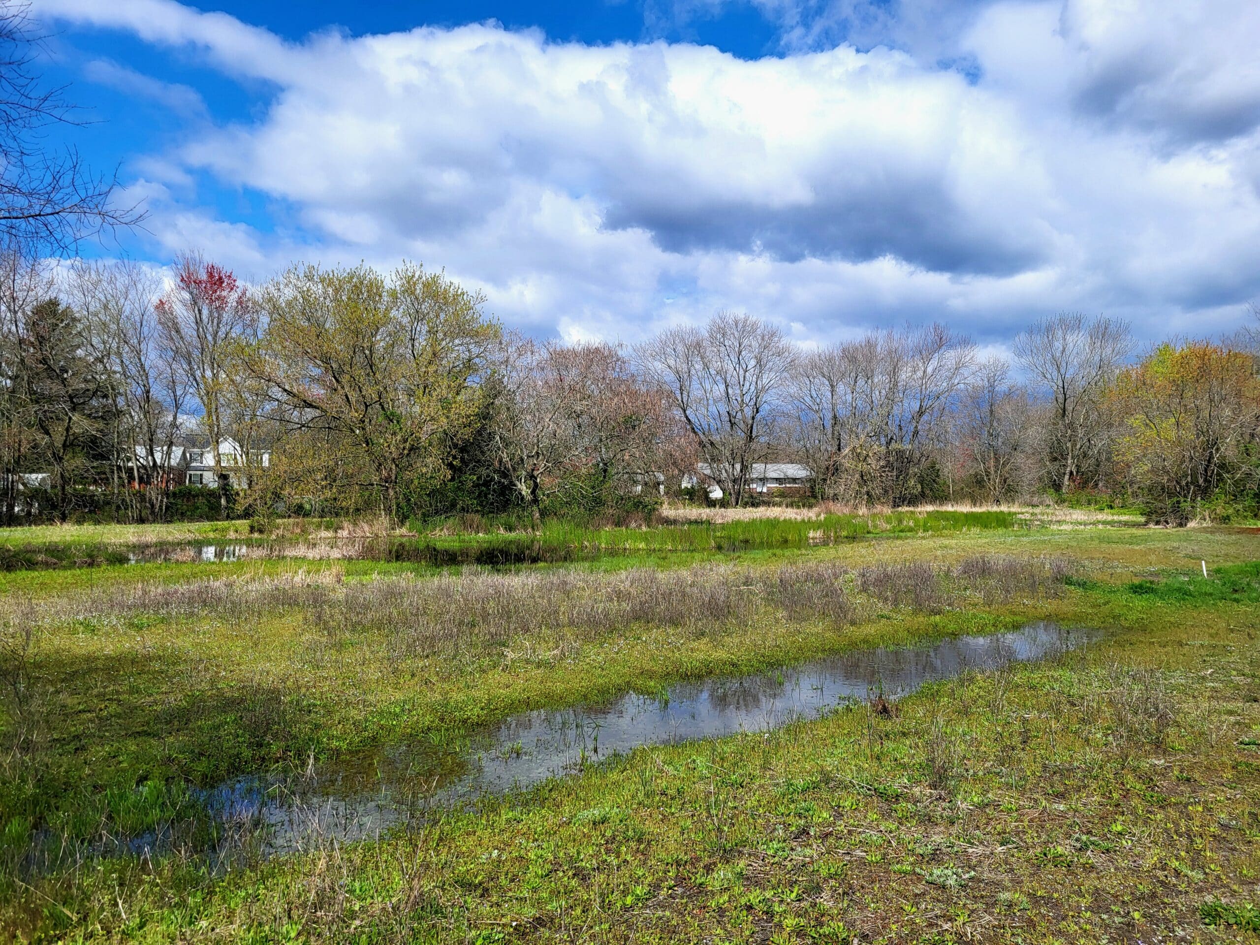 a segment of a field that is indented and filled with water